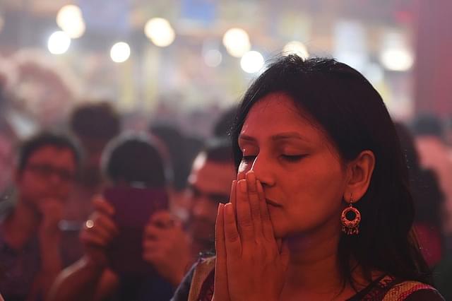 A devotee prays to the Mother (SAJJAD HUSSAIN/AFP/Getty Images))&nbsp;