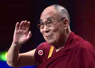 The Dalai Lama
gestures as he arrives for a meeting with young people in France. Photo credit: PATRICK
HERTZOG/AFP/GettyImages