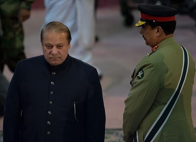 
Pakistani Prime Minister Nawaz Sharif (L) walks past army chief 
Raheel Sharif. (Photo Credit: AAMIR QURESHI/AFP/Getty Images)

