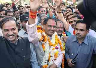 Madhya Pradesh Chief Minister Shivraj Singh Chouhan (C) (STR/AFP/Getty Images)