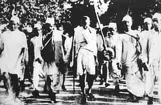 Mohandas Karamchand Gandhi (C) is pictured with his followers on the famous salt march to Dandi (AFP/Getty Images)