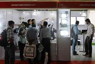 Visitors check out
various LED lighting devices on display at the India Electronics Week
exhibition at the Bangalore International Exhibition Centre. Photo credit:
MANJUNATH KIRAN/AFP/GettyImages