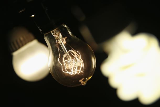 A vintage-style incandescent light bulb (C), with an LED light bulb (L) and a compact florescent (CFL) light bulb (Scott Olson/Getty Images)