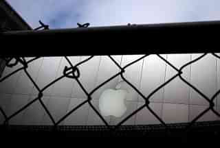 
The Apple logo as seen through a 
fence. (Photo by Justin Sullivan/Getty Images)

