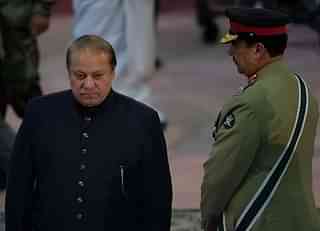 Pakistani Prime Minister Nawaz Sharif, left, walks past former army chief Raheel Sharif (AAMIR QURESHI/AFP/GettyImages)