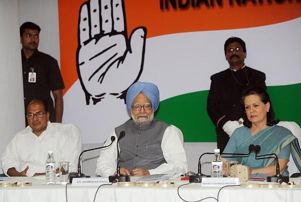 Former prime minister Manmohan Singh (C), Congress Party President Sonia Gandhi (R) and former defence minister A K Antony (RAVEENDRAN/AFP/Getty Images)