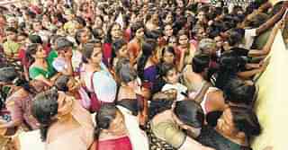 Women wait for their turn to take photograph for the new ration card at a camp in Kottayam. (Photo by <a href="http://english.manoramaonline.com/news/kerala/ration-card-fiasco-kerala-government-mistakes.html">Manorama Online</a>)