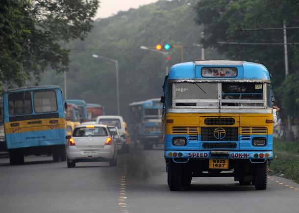 Black fumes smoke from a bus in Kolkata (Photo Credit: DESHAKALYAN CHOWDHURY/AFP/Getty Images)