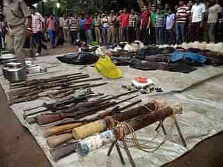 Arms seized from
Maoists are displayed at the Malkangiri district police headquarters. Photo credit: STR/AFP/GettyImages<b></b>