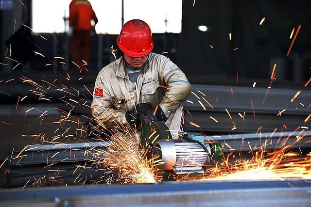 A
worker polishing a piece of work at a structural steelworks company in Rizhao,
in eastern China’s Shandong province.  Photo
credit: STR/AFP/GettyImages