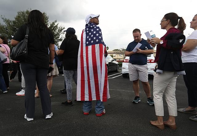 A Hillary supporter draped in the American flag (Joe Raedle/Getty Images)&nbsp;