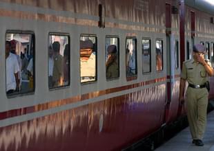 A policemen walks past the Rajdhani
Express prior to it’s departure from a station in Kolkata. Photo credit: DESHAKALYAN CHOWDHURY/AFP/GettyImages
