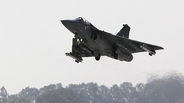 
An Indian Light Combat Aircraft Tejas flies during an 
‘Initial Operational Clearance’ procedure. Photo credit: STRDEL/AFP/GettyImages

