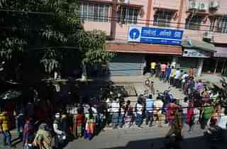 

Indian customers line up at an SBI ATM in Siliguri. Photo credit: DIPTENDU DUTTA/AFP/Getty Images