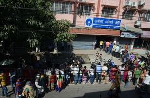 Indian customers line up next to an ATM at a bank in Siliguri. (DIPTENDU DUTTA/AFP/Getty Images)