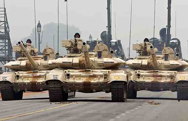 
Indian Army T-90 ‘Bheesma’ tanks roll through Janpath during 
rehearsals for the Indian Republic Day parade in New Delhi. (Photo Credit: RAVEENDRAN/AFP/Getty Images)

