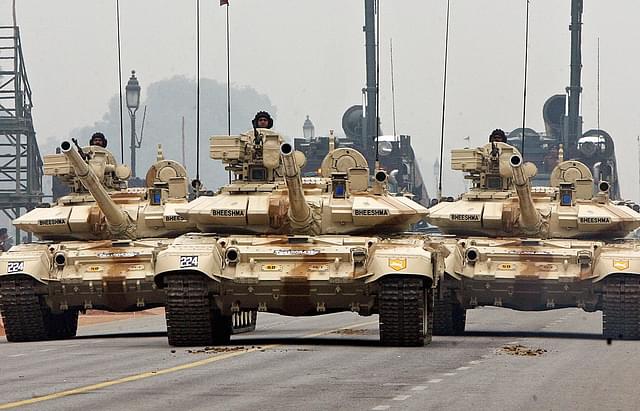 
Indian Army T-90 ‘Bheesma’ tanks roll through Janpath during 
rehearsals for the Indian Republic Day parade in New Delhi. (Photo Credit: RAVEENDRAN/AFP/Getty Images)

