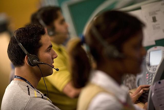 
Indian operators take calls at Quatrro call-centre in Gurgaon. Photo credit: FINDLAY KEMBER/AFP/GettyImages

