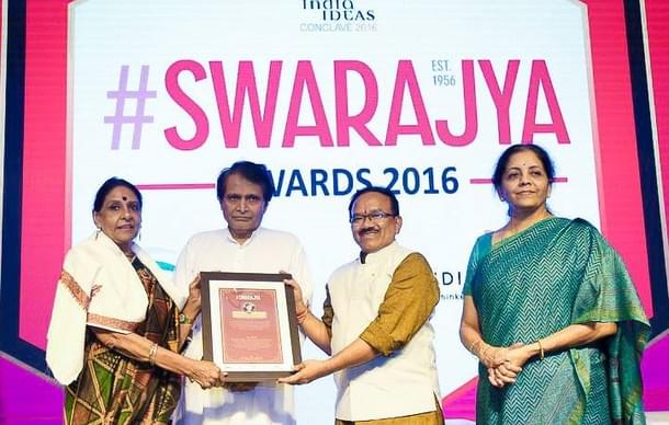 Jaitly receiving a plaque