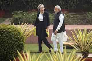 British Prime Minister Theresa May and Indian Prime Minister Narendra Modi walk through the gardens of Hyderabad House. (Dan Kitwood/Getty Images)