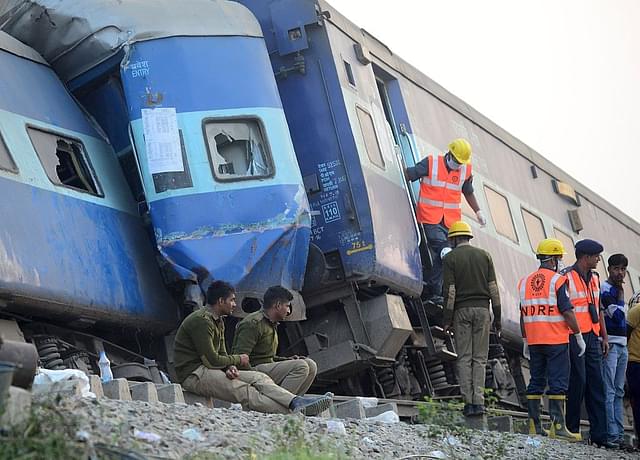 

Indian rescue workers search for survivors in the wreckage of Patna-Indore express train. (SANJAY KANOJIA/AFP/GettyImages)