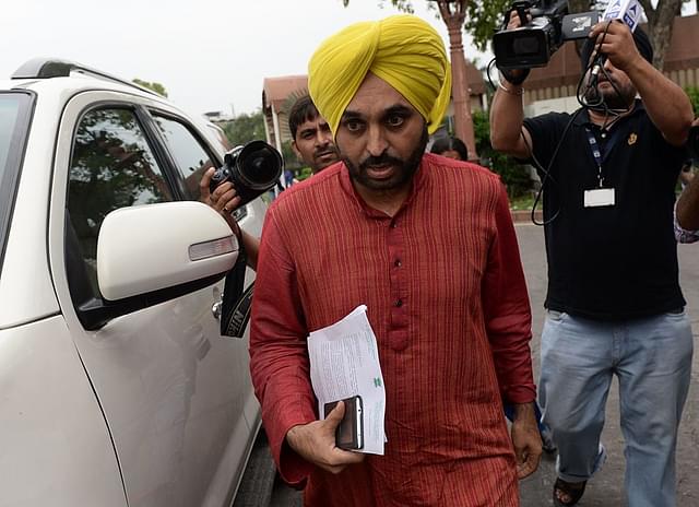 Aam Aadmi Party (AAP) Member of Parliament Bhagwant Mann arrives at the Indian parliament to appear before an inquiry committee in New Delhi. Photo credit: PRAKASH SINGH/AFP/Getty Images