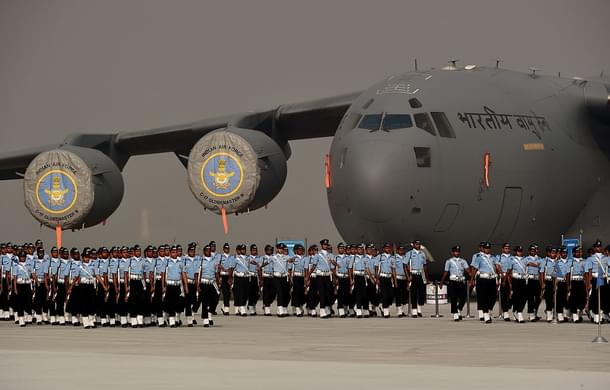 Indian Air Force
personnel march past a C-17 Globemaster during the Air Force Day parade on the
outskirts of New Delhi. Photo credit: MONEY SHARMA/AFP/GettyImages 