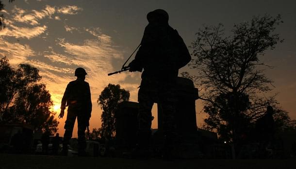 Indian army soldiers patrol on the Jammu-Srinagar National Highway during a combing operation at Nagrota,  Jammu. Photo credit: STRINGER/AFP/Getty Images