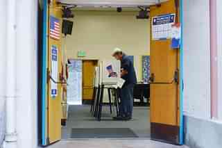 A voter casts his ballot at Allesandro Elementary School in California.  Photo credit: Kevork Djansezian/GettyImages