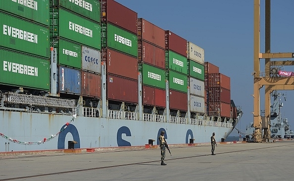 Pakistani Naval personnel
stand guard near a ship carrying containers at the Gwadar port, some 700 km
west of Karachi. Photo credit: AAMIR QURESHI/AFP/GettyImages