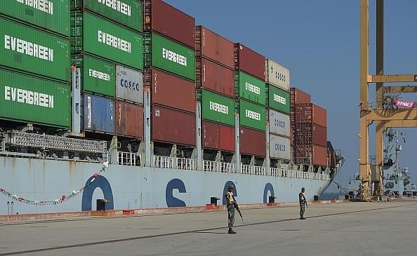 Pakistani Naval personnel
stand guard near a ship carrying containers at the Gwadar port, some 700 km
west of Karachi. Photo credit: AAMIR QURESHI/AFP/GettyImages