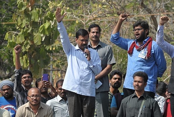 Delhi Chief Minister Arvind Kejriwal talks during a protest over the suicide of a student at Hyderabad Central University. Photo credit: NOAH SEELAM/AFP/Getty Images