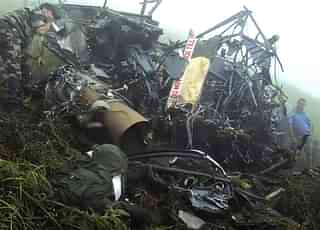 File picture: The wreckage of a 3 Corps Cheetah helicopter following a crash in Nagaland  on 18 August 2010. Photo credit: STRDEL/AFP/GettyImages

