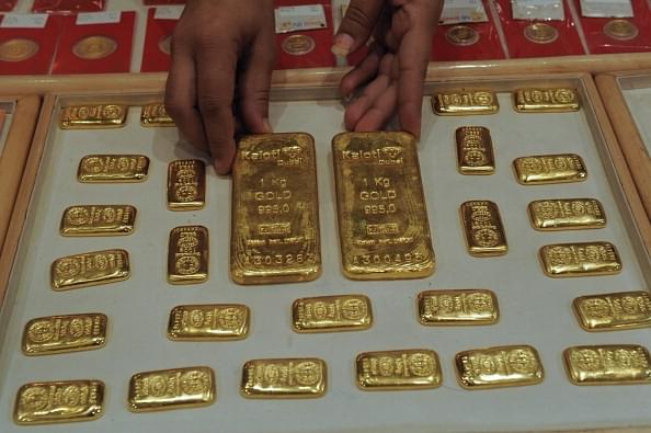 

An Indian saleswoman arranges gold bars at a jewellery store in Ahmedabad.&nbsp;