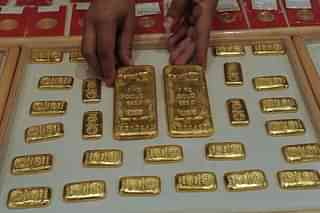

An Indian saleswoman arranges gold bars at a jewellery store in Ahmedabad.&nbsp;