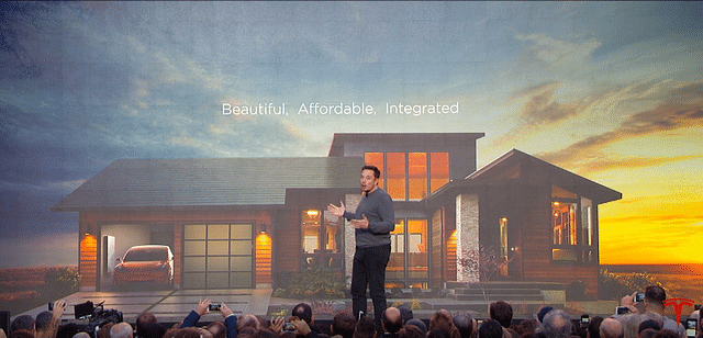 Elon Musk unveiling his latest offering, solar rooftop tiles (Photo Credit: SolarCity)