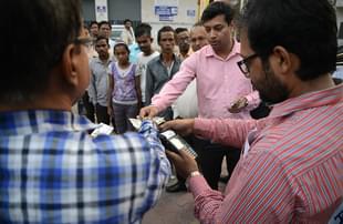 State Bank of India bank
staff assist customers to withdraw money with the use of a mobile banking
machine at Siliguri District hospital in Siliguri on 22 November 2016. Photo
credit: DIPTENDU DUTTA/AFP/GettyImages