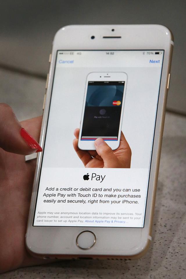 Apple Pay being used on an iPhone. Photo credit: Peter Macdiarmid/GettyImages
