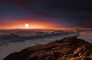 An artist’s impression of a view of the surface of the planet Proxima b orbiting the red dwarf star Proxima Centauri, the closest star to the Solar System. (M. KORNMESSER/AFP/Getty Images)