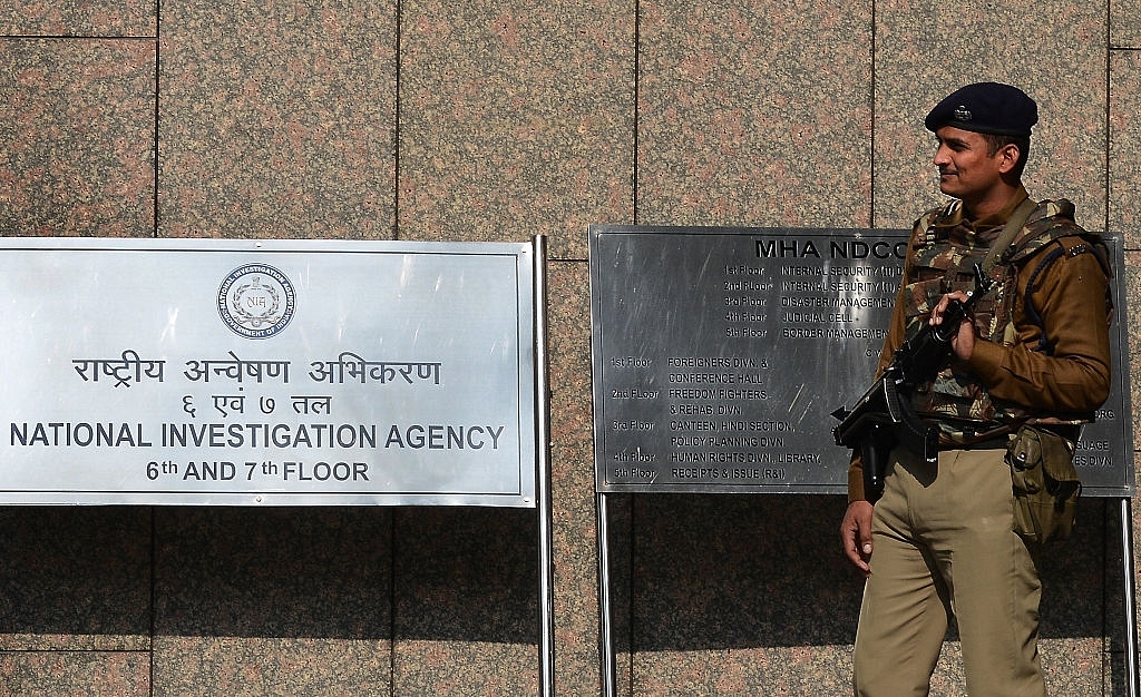 A security guard outside the office of NIA. (MONEY SHARMA/AFP/Getty Images)