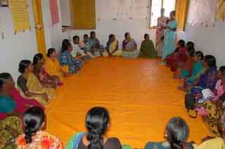 Women from Self-Help Groups take part in a meeting. (Photo credit: SERPEditor/Wikimedia Commons)