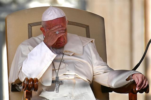 

Pope Francis prays during his general audience in St Peter’s square at the Vatican on October 5, 2016. / AFP / VINCENZO PINTO (Photo by VINCENZO PINTO/AFP/Getty Images)