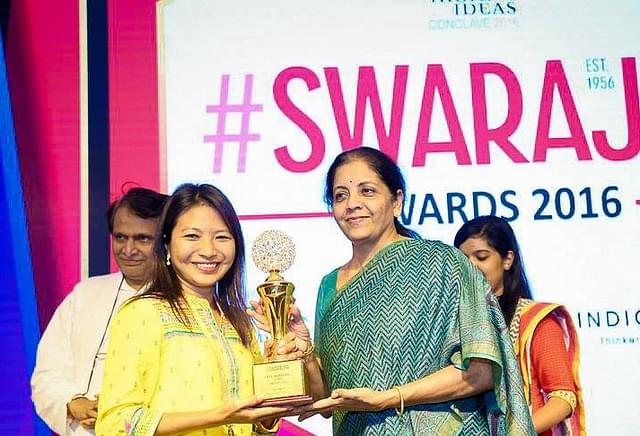 Imsong receiving her award from Sitharaman