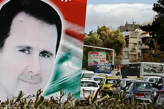 An Assad hoarding (LOUAI BESHARA/AFP/Getty Images)