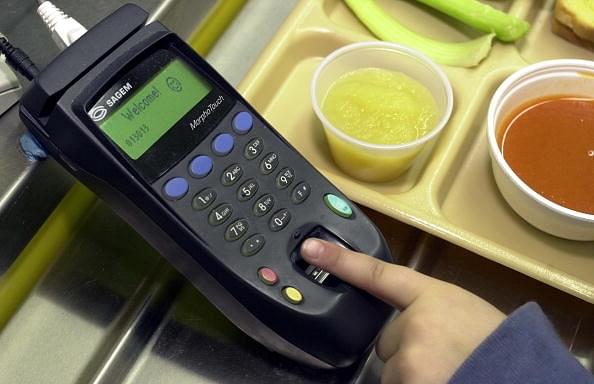 

A student places a finger on the fingerprint scanner to pay for lunch at Penn Cambria Pre-Primary School in Altoona, Pennsylvania. Photo credit: William Thomas Cain/GettyImages