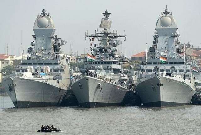 Indian naval sailors
on a rubber inflatable boat pass naval warships at the Naval Dockyard in
Mumbai. Photo credit: INDRANIL MUKHERJEE/AFP/GettyImages