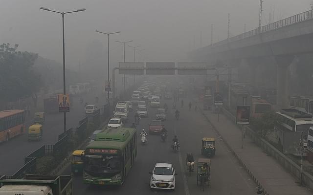 

Motorists drive on a major road as smog covers Delhi. Photo credit: PRAKASH SINGH/AFP/GettyImages