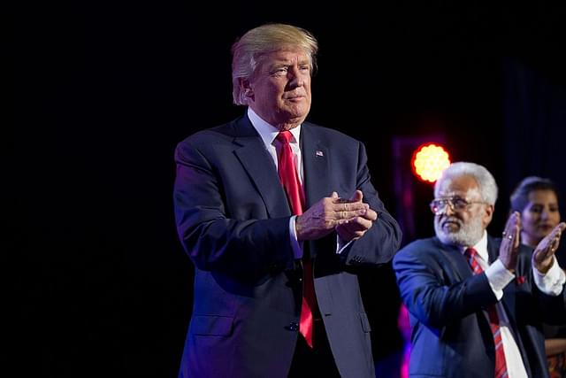 President-elect Donald Trump applauds the crowd after speaking at a Hindu political organisation’s anti-terror fundraiser. Photo credit: DOMINICK REUTER/AFP/Getty Images