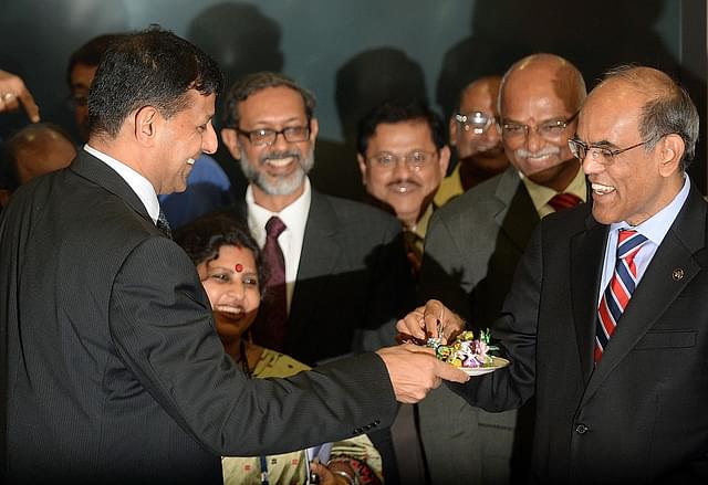 

Reserve Bank of India’s (RBI) newly appointed governor Raghuram Rajan (L) offers sweets to outgoing governor Duvvuri Subbarao (R) during the hand over ceremony at the RBI headquarters in Mumbai on September 4, 2013. Top economist Raghuram Rajan, renowned for predicting the 2008 global financial crisis, takes over as head of India’s central bank on September 4, amid the country’s worst financial storm in years. AFP PHOTO/ PUNIT PARANJPE (Photo credit should read PUNIT PARANJPE/AFP/Getty Images)