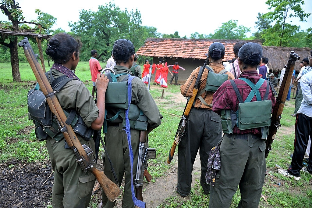 
Indian Maoists. Photo credit: NOAH SEELAM/AFP/GettyImages

